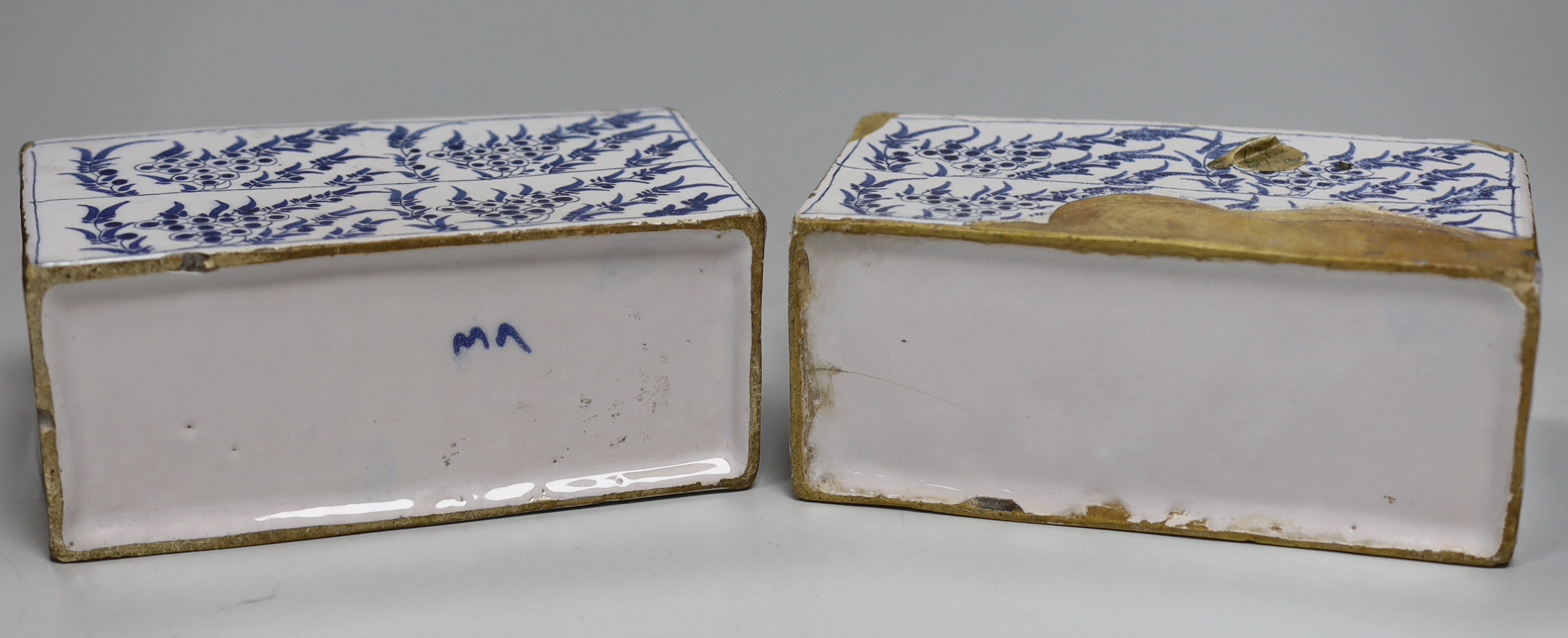 A pair of 18th century Delft flower bricks, 9.4cm high